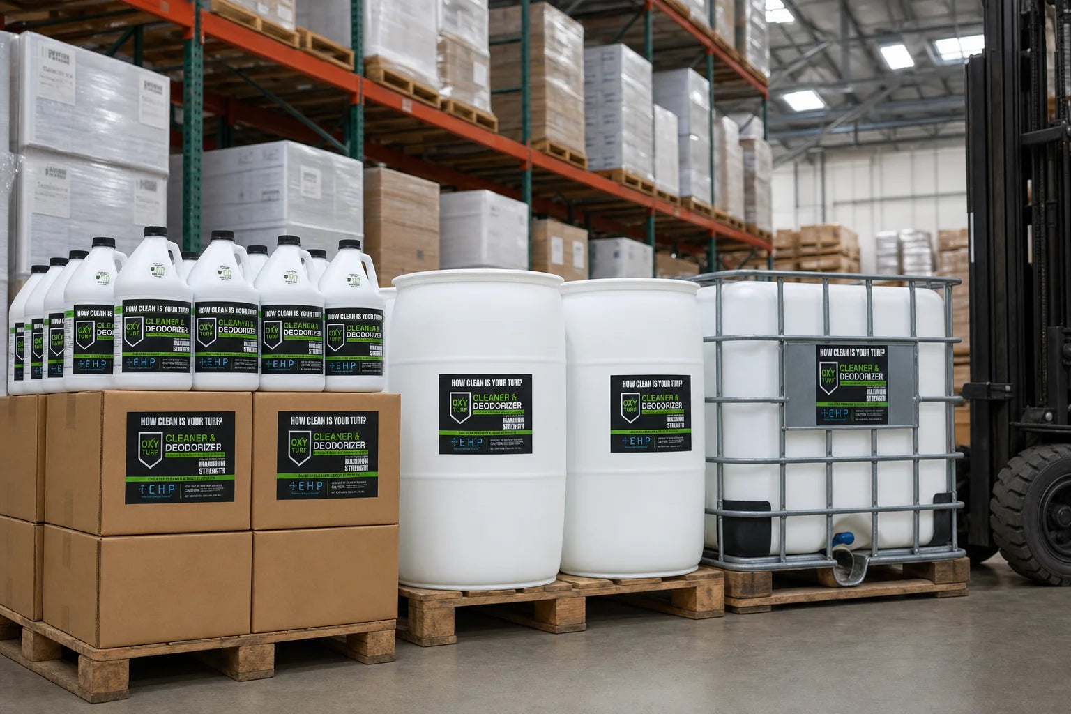 White drums, an IBC tote, and palletized gallon jugs in a distribution warehouse